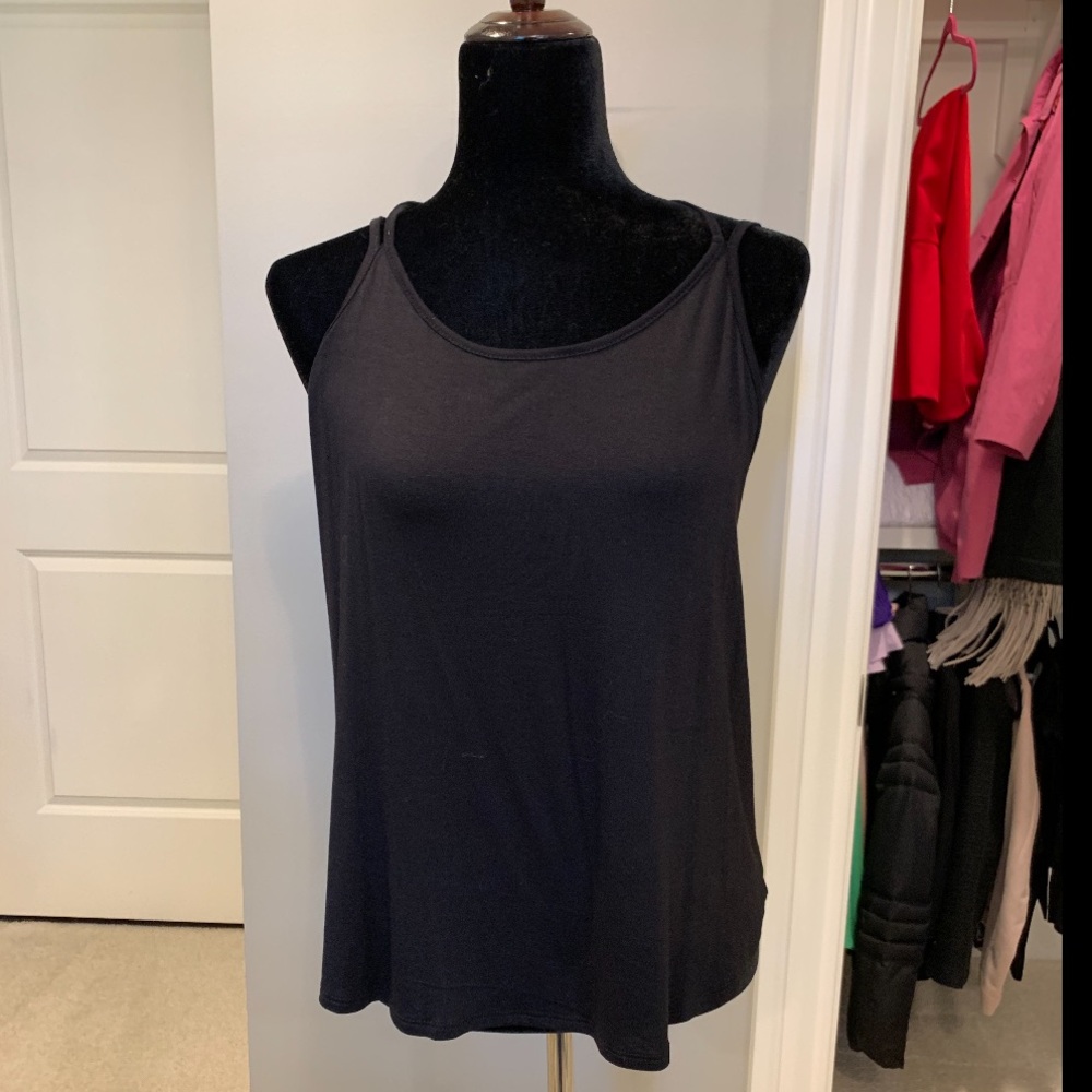 LuLus black tank with criss cross straps in the ba